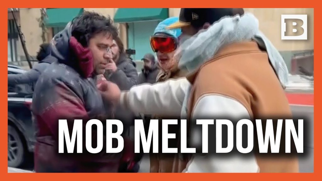 Screaming Anti-ICE Minneapolis Mob Forces Man to Take Off “Freedom” Hoodie