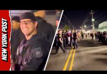 Officer Pushes Anti-ICE Protester Headfirst Over Barricade